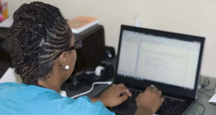 Woman typing on the computer