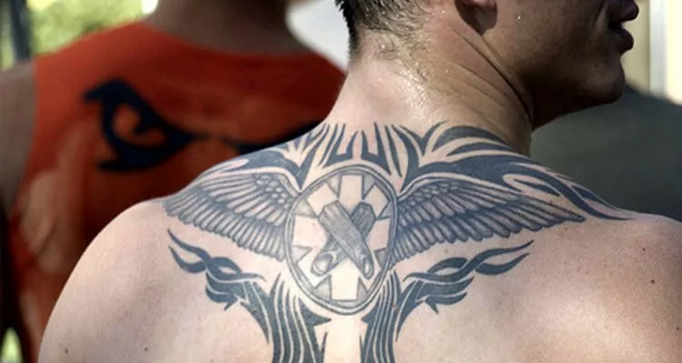 Picture of a man with a tattoo on his shoulder