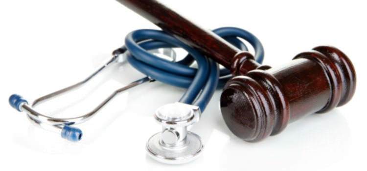 Gavel on top of a stethoscope