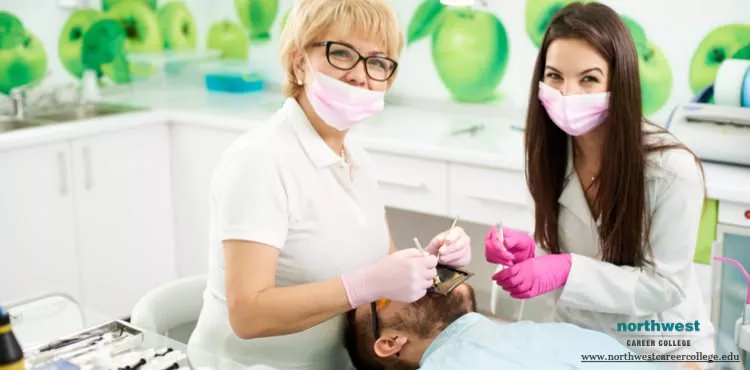 Dental assistant assisting a doctor