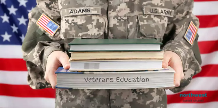 A female veteran holding books stacked on top of eachother in her arms.