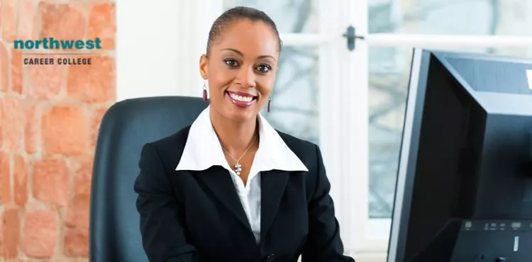A female paralegal looking at the camera and smiling.