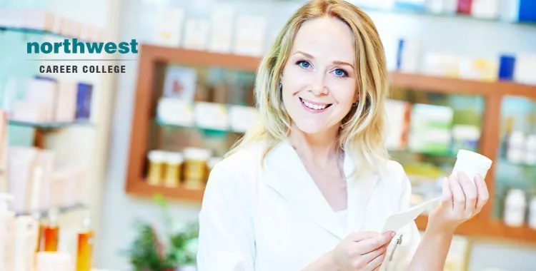 A woman pharmacy technician looking at description written on a medicine bottle.