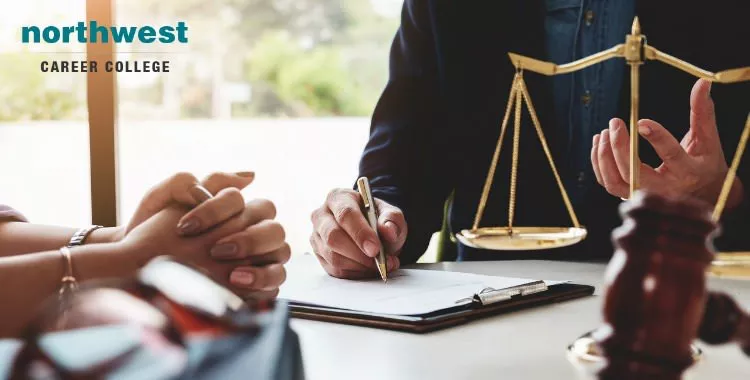 A man is Consulting paralegal terms to a woman.