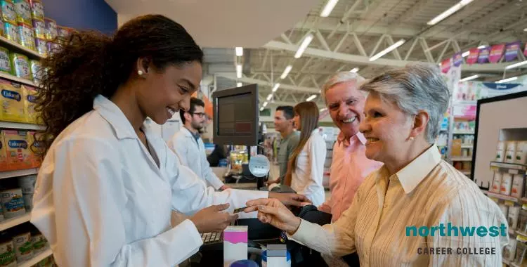 The pharmacist describing to customers