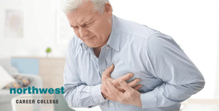 senior citizen clutching at his chest because he is having cardiac arrest