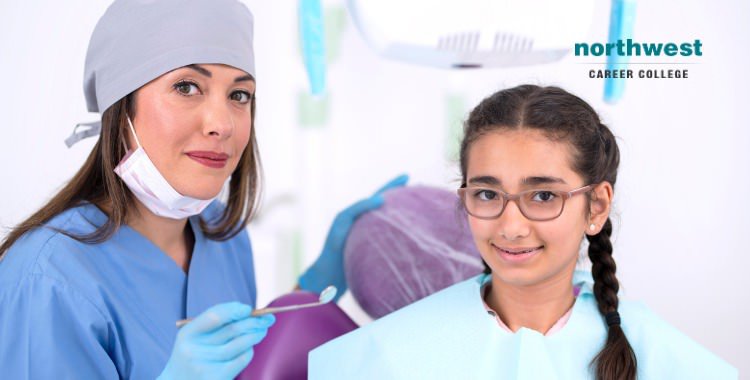 A dental assistant Helping Pediatric Dental Patient stay calm.