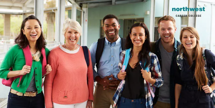 cheerful adult students hanging out in school