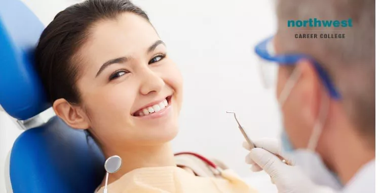 A dental assistant putting a dental patient at ease.