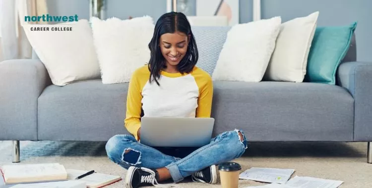 A woman on her laptop using an app to study.