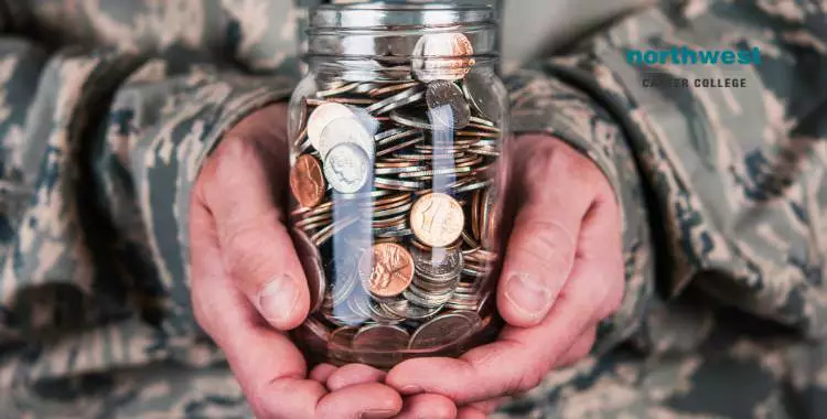 military serviceman holding a jar of coins in his hand.
