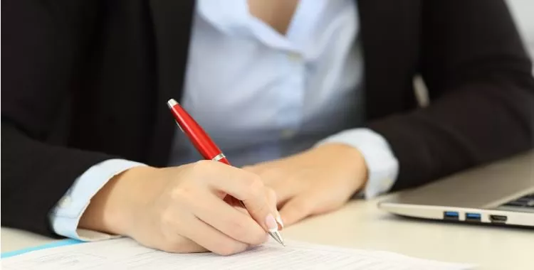 legal assistant filling documents