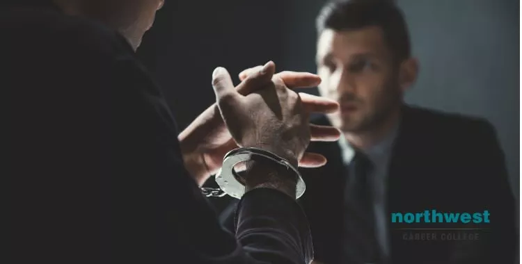 criminal man-with-handcuffs-being-interviewed by Probation Officer
