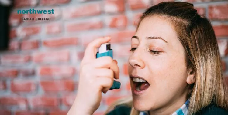 A woman using an inhaler, highlighting the importance of asthma management for asthma sufferers.