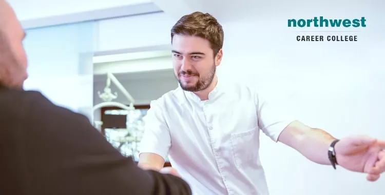 dental admin assistant and patient-shaking hands after appointment