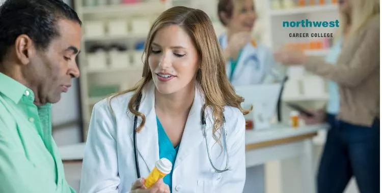 female pharmacist consults with male patient