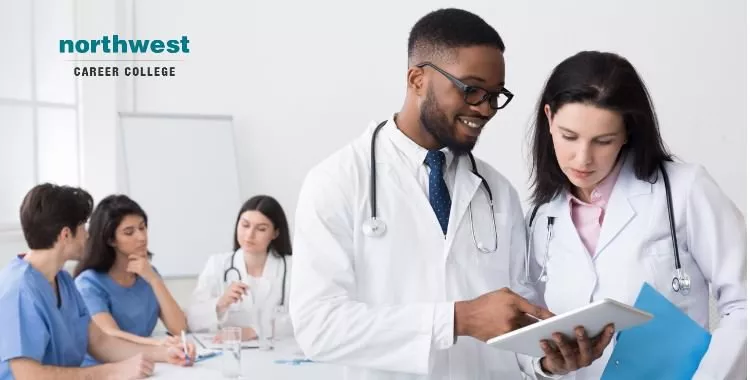 Medical Assistant to his colleague during meeting