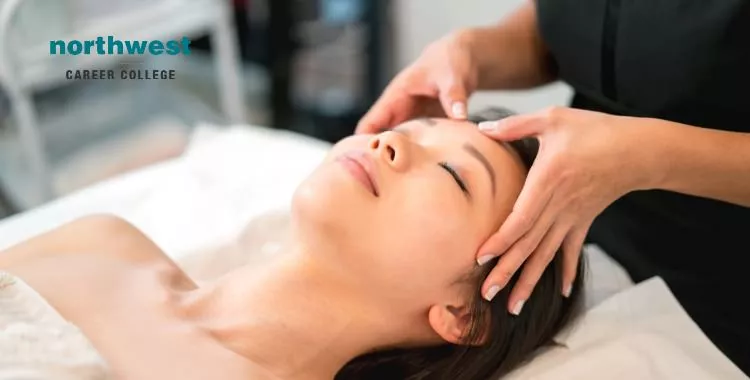 Asian woman getting a face massage at the spa