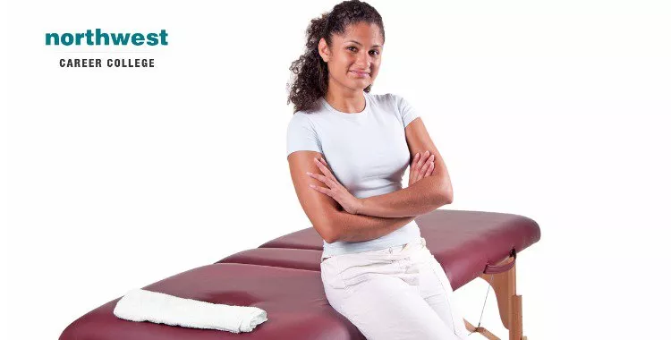 massage table with proud massage therapist