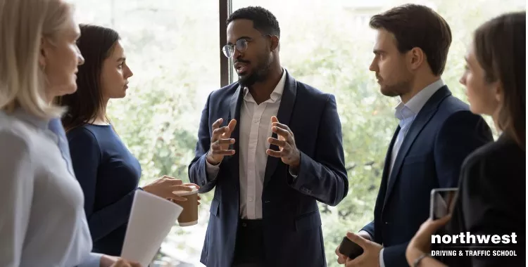 A diverse group discusses business concepts, highlighting that English is the language of business.