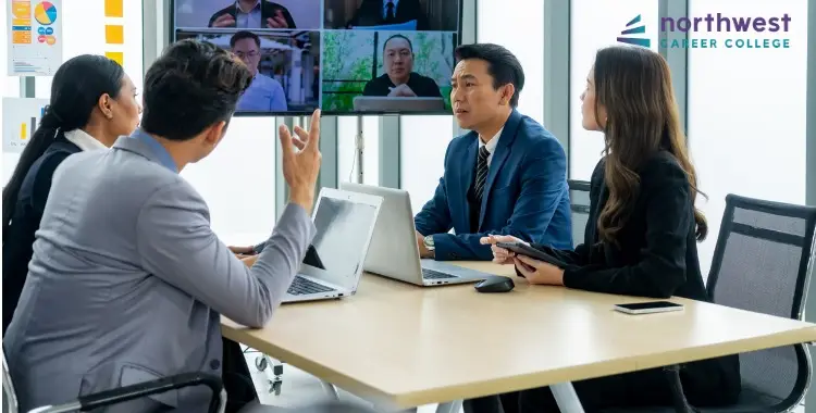 A team discusses E-commerce Strategies during a video conference in a modern meeting room.