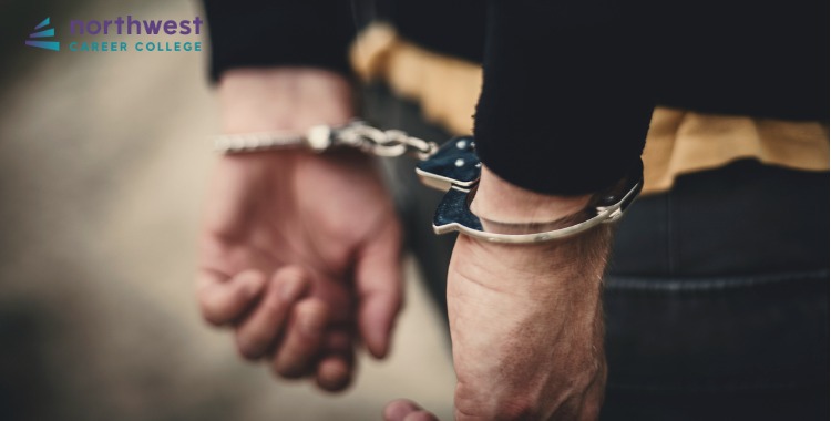 Hands in handcuffs symbolize the complex relationship between poverty and crime.