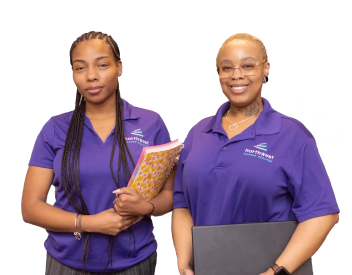 Two women in purple polo shirts, smiling and holding notebooks, representing business administrative assistant roles.