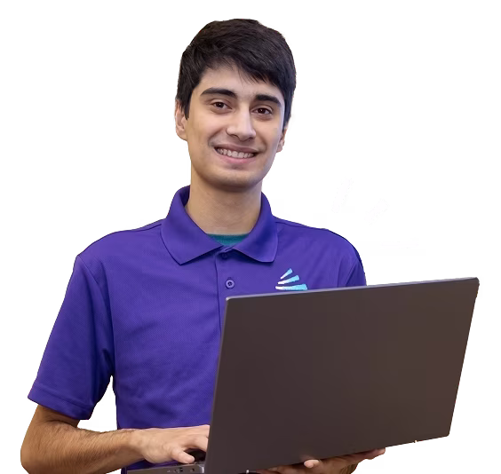 A smiling student in a purple shirt holds a laptop, representing an it technician school environment.