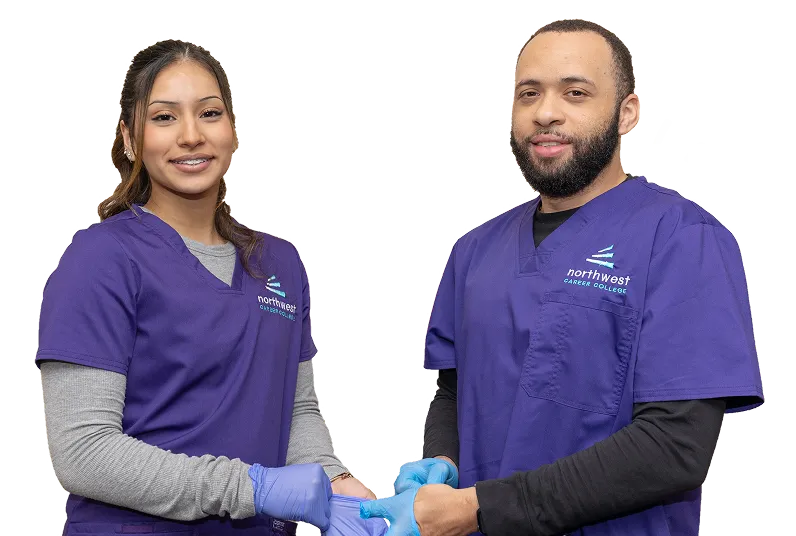 Two students in scrubs practice phlebotomy skills, representing phlebotomy programs Las Vegas at Northwest Career College.