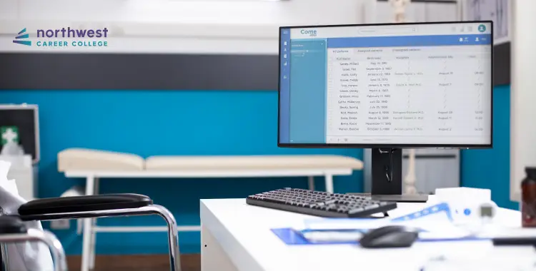 A computer monitor displays a list of appointments in a modern office setting with a medical examination table.