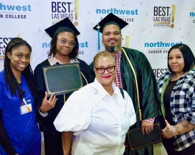 NAA BAA students at graduations pose together, celebrating their achievements in caps and gowns with proud family members.