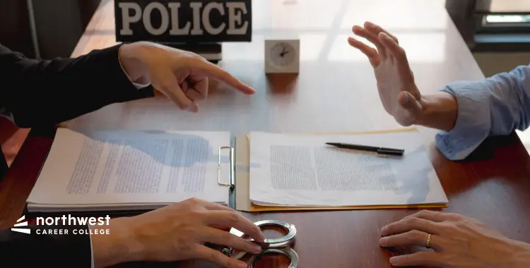 Two hands gesturing over a table with documents and handcuffs, with a POLICE sign in the background.