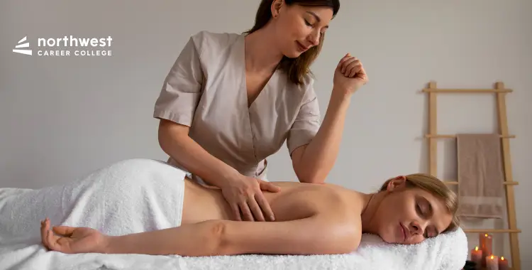 A massage therapist provides a back massage to a client in a serene, spa-like setting.