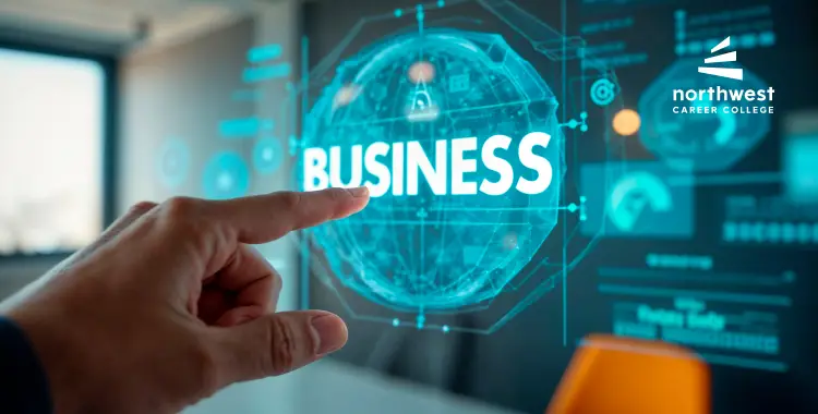 A hand points at a digital display featuring the word BUSINESS and data graphics in a modern office setting.