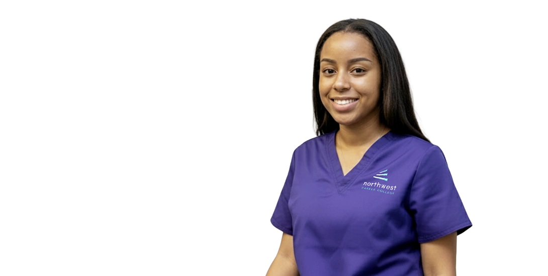 Smiling student in purple scrubs, representing a medical administrative assistant school at Northwest Career College.