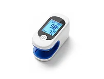 A white pulse oximeter with a blue base, displaying readings of 98% and 72 on a digital screen.