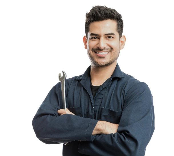 Smiling mechanic holding a wrench, representing careers from automotive schools in Las Vegas.